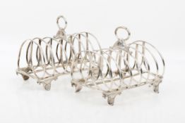 A pair of early 19th century silver toast racks.