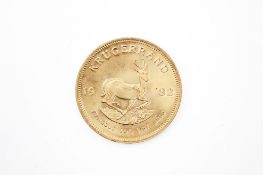 A 1982 1oz kruger rand coin. Weight 34.1g.