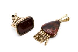 A hardstone fob seal and a hardstone pendant.
