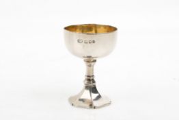 An early 20th century silver travelling communion chalice.