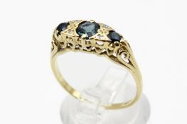 An 18ct gold (tested) and sapphire carved half hoop ring.