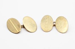 A pair of 9ct gold cufflinks. One of each with engine turned decoration, hallmarked, gross weight 4.