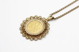 A mounted 1982 half sovereign coin.