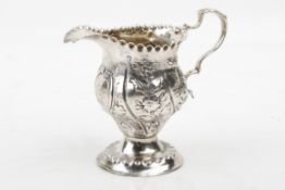 A George III cream jug.