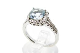 An 18ct white gold and aquamarine cluster ring.