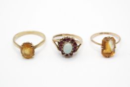 Two 9ct gold and yellow metal citrine and cluster rings.