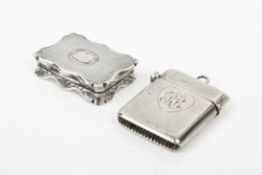 A Victorian silver vinaigrette and a vesta case.