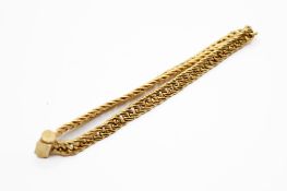 An unmarked yellow metal curb link child's bracelet.