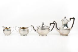 A 1920s matched four-piece silver tea and coffee set.