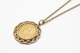 A mounted 1912 half sovereign coin and chain. The mount and chain hallmarked/tested as 9ct gold.