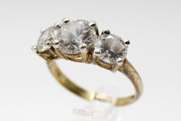 A gold plated and cubic zirconia dress. With three round cut stones, size Q, gross weight 4.2g.