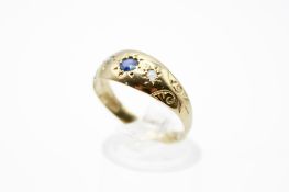 An 18ct gold ring with small sapphire and diamonds in star settings.