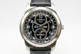 A Tissot Moonphase wristwatch with box and booklets.