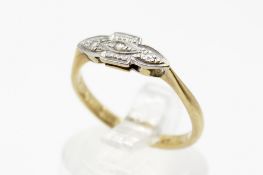 An 18ct gold and platinum (tested) ring. Set with a diamond chip, size M. gross weight 2.5g.