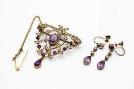 An Edwardian openwork brooch and earrings.