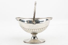 A George III silver swing handle sugar basket.