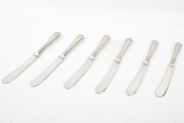 A set of six silver hallmarked handled butter knives with plated blades.