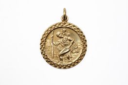 A 9ct gold St Christopher pendant. Hallmarked, 2.8cm diameter, weight 8.3g.