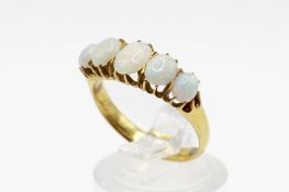 A yellow metal and opal ring.