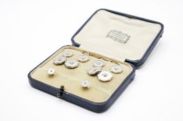 A gold and platinum set of dress studs and cufflinks.