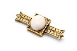 A 19th century Etruscan revival style yellow metal brooch.