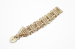 A 9ct gold gate link bracelet. Width 2.5cm, length 16.