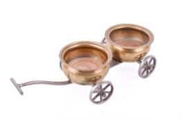 A vintage novelty table bottle trolley.