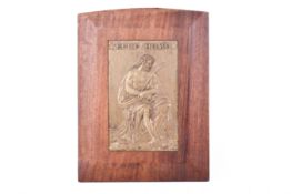 A biblical brass plaque in mahogany frame with latin text 'ECCE HOMO'.