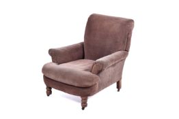 A late 19th Century Howard & Sons manner country house armchair.