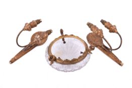 A pair of carved giltwood wall sconces. and a glass pendant ceiling shade.