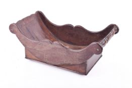 A Georgian mahogany crescent-shaped cheese coaster.