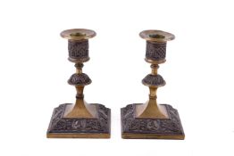 Pair of late Victorian Aesthetic style brass and copper candlesticks.
