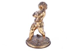 A 19th century French gilt bronze of a boy juggler with hoops, cups and balls at his feet,