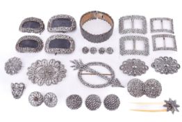 A collection of Georgian steel cut shoe buckles of varying design along with a bangle. Largest 6.