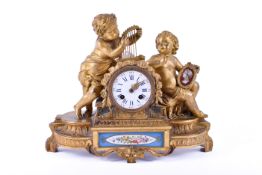 A 19th century French figural gilt bronze mantel clock.