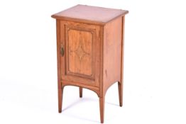 A late 19th / Early 20th century, satinwood cupboard.