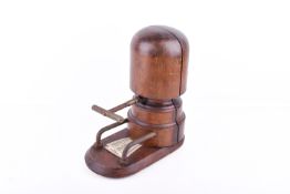 An early 20th century vintage milliner's hat stretcher.