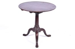 A 19th Century mahogany tilt top birdcage circular table.