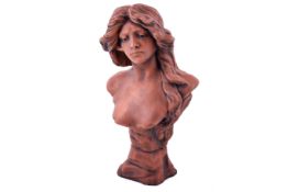 A terracotta coloured Art Nouveau style bust of a young woman. Based on the French artist L.