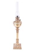 An early 20th century American brass New Rochester oil lamp and glass funnel.