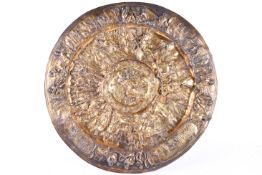 A brass ornate brass charger.