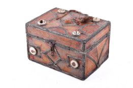 An Islamic style possibly Moroccan wood and metal casket with inlay.