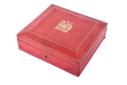 A red leather presentation box by John Peck & Son of Blackfriars,