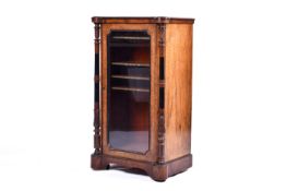 A late 19th/early 20th century walnut and burwood music cabinet.