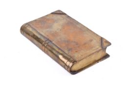 A 'Trench art' brass secret box in the form of a small book. Having sliding cover. H11.