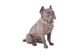 After Bergmann, a cold painted bronze model of a seated dog. Remains of cold painting.