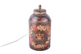 A vintage hand painted toleware tea canister converted to a lamp.