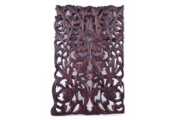 A carved hard wood panel with mirrored, pierced foliate pattern, H43.