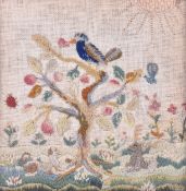 A crewel work embroidery of a bird in a tree, probably 19th century.