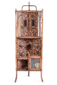 A Victorian Aesthetic Movement bamboo open corner cupboard.